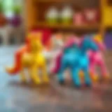 Colorful plastic unicorn toys on a wooden surface
